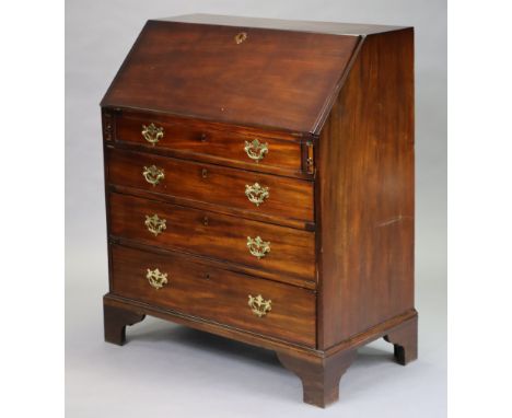 An 18th century mahogany bureau with fitted interior and gilt-tooled leather writing surface enclosed by a sloping fall-front