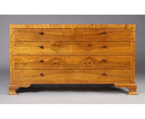 A continental-style walnut dwarf double chest fitted two short &amp; three long drawers with turned knob handles, &amp; on br