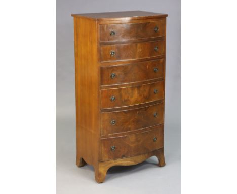 A mahogany tall bow-front chest fitted six long graduated drawers with iron ring handles, &amp; on o-gee bracket feet, 60.5cm