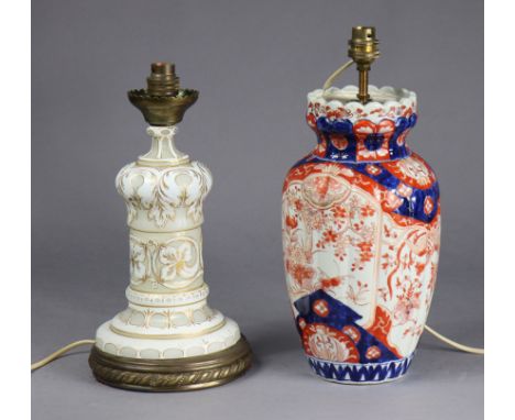 A late 19th century opaque glass table lamp with white-overlaid decoration, &amp; an Imari vase table lamp, 33cm &amp; 37cm h