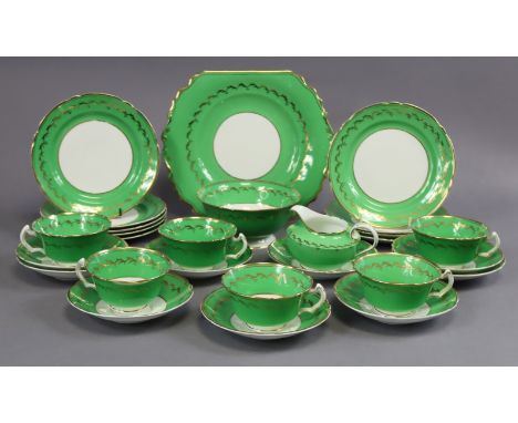 A continental porcelain twenty-seven piece part tea service of green &amp; white ground with gilt decoration comprising six t