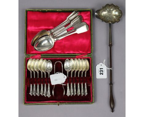 A Victorian silver punch ladle with a turned wooden handle 32.5cm long, London 1844?; a set of twelve plated teaspoons; a mat