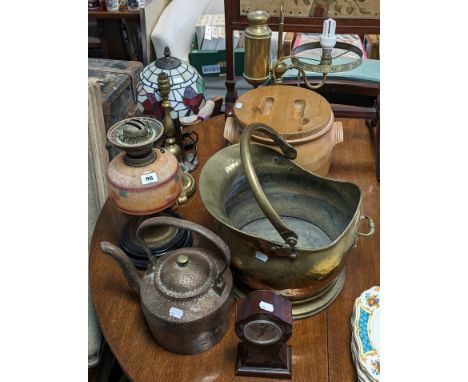 An Edwardian brass oil table lamp with an orange mottled glass reservoir &amp; on a black ceramic base; together with three o