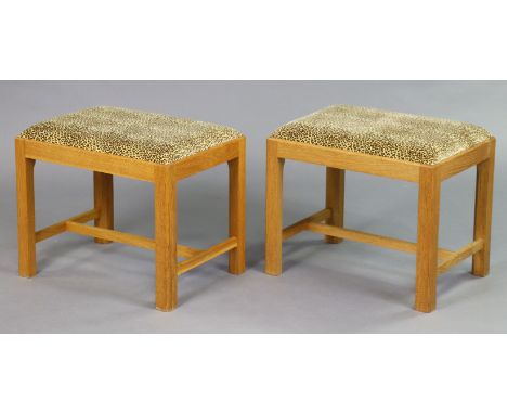 A pair of light oak dressing table stools each with a padded drop-in-seat upholstered leopard print material, &amp; on square