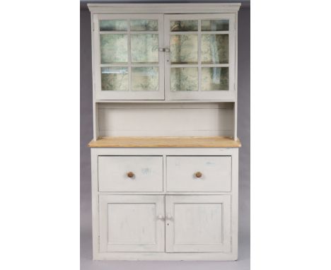 A light grey painted &amp; natural pine dresser, the upper part fitted three shelves enclosed by a pair of glazed doors above