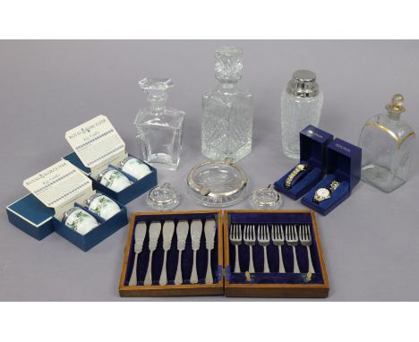 An Orrefors glass decanter; a Victorian glass decanter; another glass decanter; three glass ashtrays (one with a sterling sil