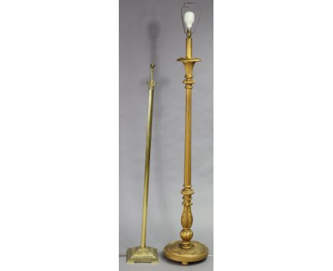 A gold painted wooden standard lamp on a vase-turned &amp; fluted centre column &amp; on a circular base, &amp; a brass stand