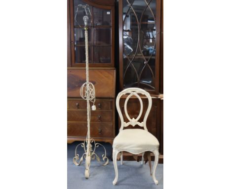 A Victorian white painted &amp; carved wooden balloon-back salon chair with a padded seat, &amp; on slender cabriole legs; to