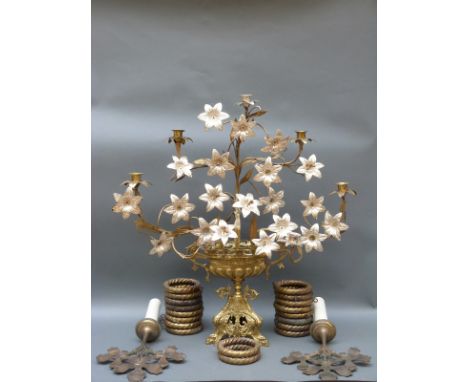 A brass and glass hanging hall light, ornate floral brass candelabra, brass curtain rings and holdbacks