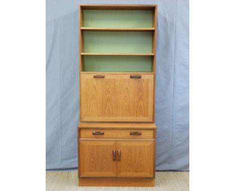 A retro G plan bookcase with fall flap bureau door, a single drawer and twin door cupboard with shelf (H200 x W84 x D46cm)