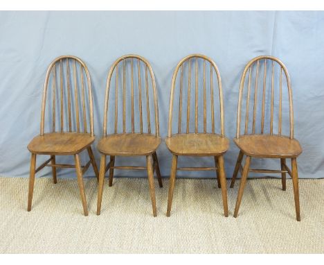A set of four Ercol hoop and stick back dining chairs