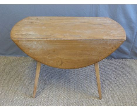 A retro Ercol light elm table (H71 x L112 x D122cm)