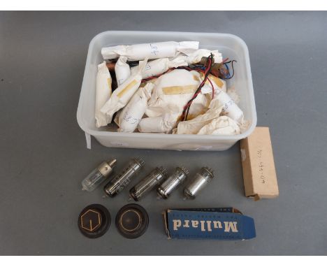 A collection of radio valves etc. includes some bakelite control knobs, internal aerial, speaker etc