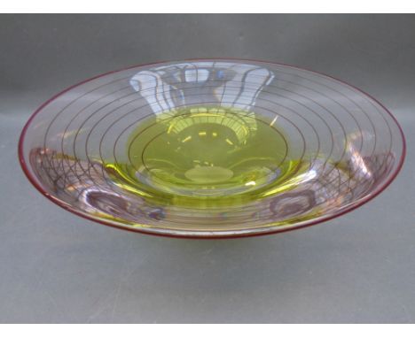 A large art glass flared bowl with yellow and red tinted decoration and spiral line design, 12cm tall, 36cm diameter 