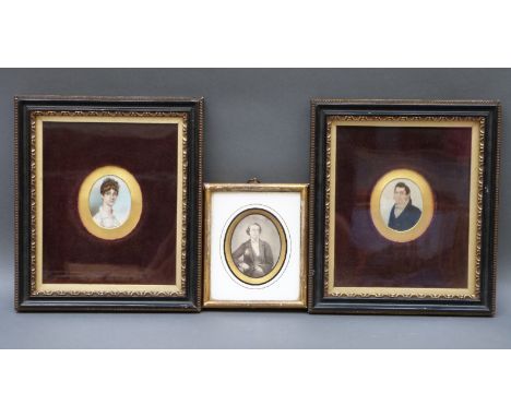 A pair of 19thC portrait miniature on ivory of a lady and gentleman, maximum diameter 6cm and a pencil miniature dated 1857 v