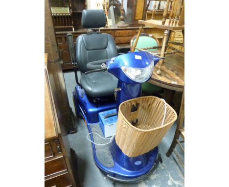 An Invacare trike mobility scooter with charger