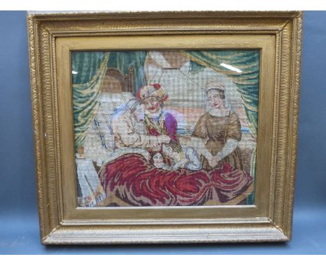 A 19thC hand embroidered tapestry depicting Jacob blessing Ephraim, framed and glazed