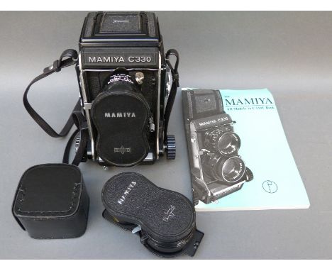 Mamiya C330 professional TLR camera, with Mamya-Sekor 1:3.5 f = 65mm and 80 lenses, book etc