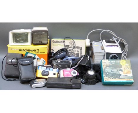 A collection of modern cameras to include Optikon 135, Canon Powershot, Kodak instomatic, Olympus trip together with viewers 