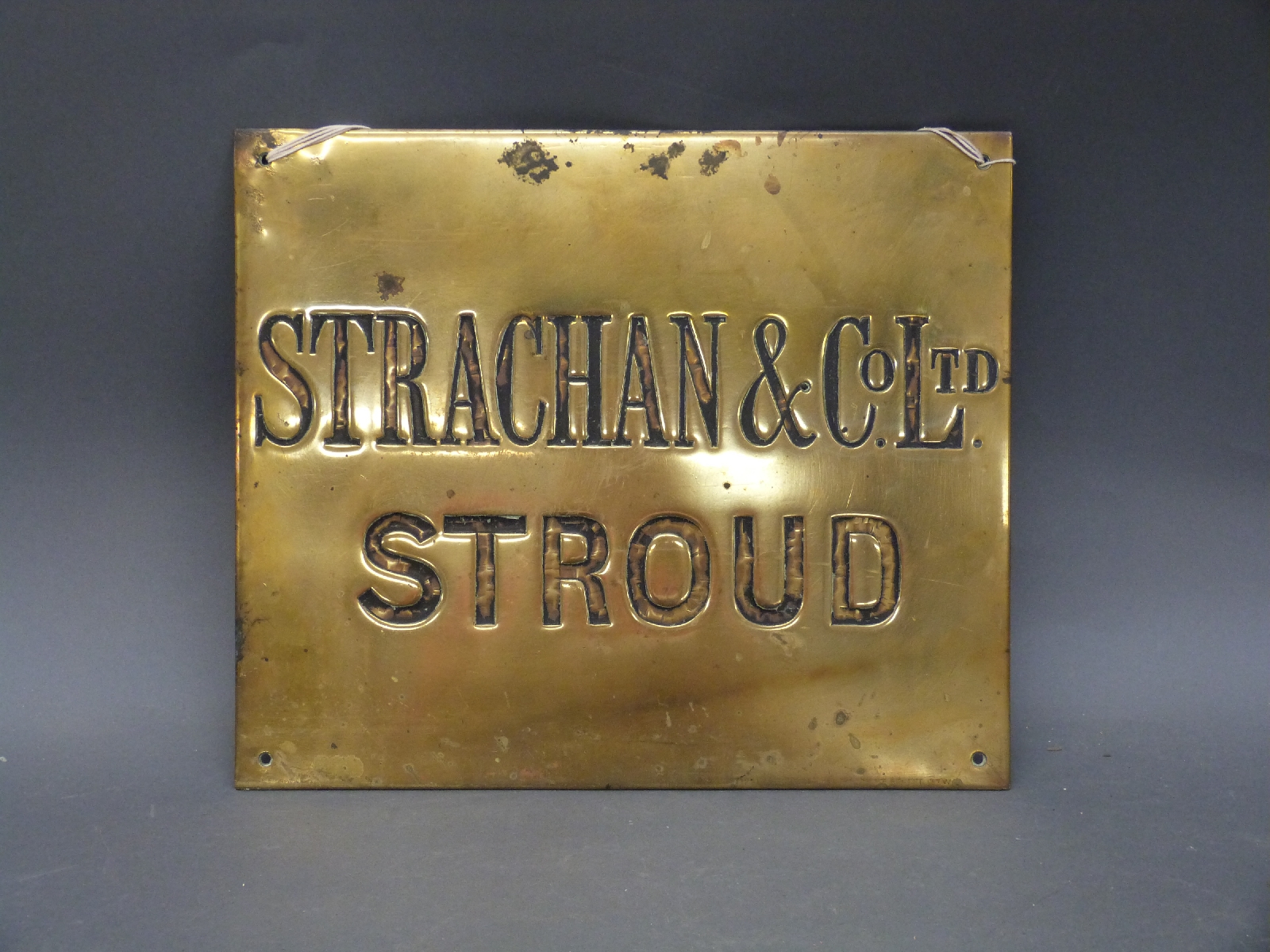 A vintage brass sign Strachan and Co Ltd, Stroud (cloth mill) 32 x 38cm