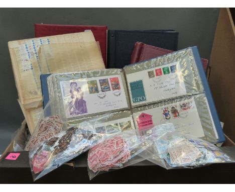 Two boxes containing a large quantity of stamps and albums and an albums of first day covers 