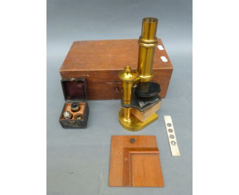 A cased E.Leitz Welzlar brass microscope with lenses and accessories, serial no 14350 to box 