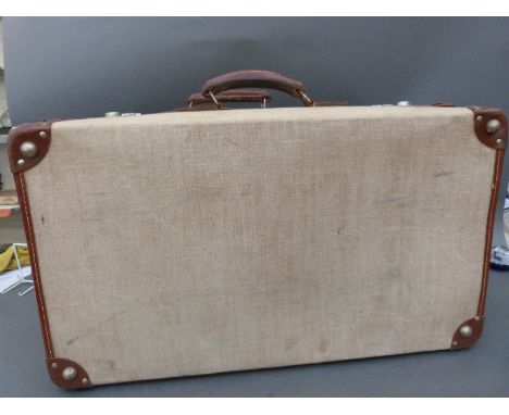 Two Ministry marked suitcases one stamped A G & Co Ltd, 1962 with broad arrow and numbered 8460-99-120-2554, the other 8460-9