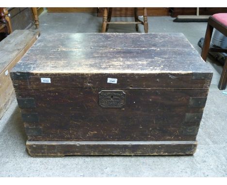 A metal bound seaman's trunk with rope handles by Miller, Rayner and Heysom Outfitters, London, Liverpool & Southampton (H50 