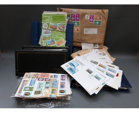 A collection of Guernsey first day covers, presentation packs, loose stamps