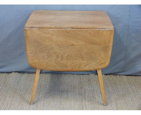 A retro Ercol light elm table (H71 x W138 x D73cm)