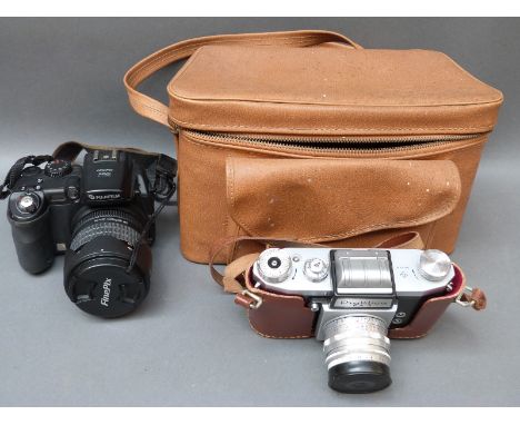 Fujifilm Finepix S9500digital camera and a vintage cased Praktica FX2 SLR with lenses