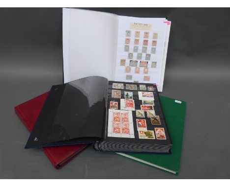 Four stockbooks containing a large collection of stamps from Switzerland, mint and used, from 1850s to modern, including earl
