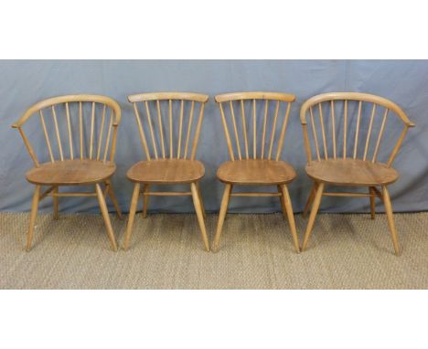 A set of four Ercol light elm chairs including two carvers