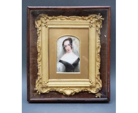 A 19thC portrait miniature on ivory of a young lady with veil in ornate surround and outer case label verso 'Eliza' wife of J