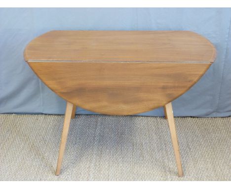 A retro Ercol light elm drop leaf table (H72 x W112 x D123cm)