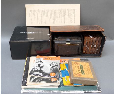 A cased Sands Hunter, London folding plate camera with Carl Zeiss Jena Tessar 1:4.5 f = 13.5mm lens, with wooden film carrier