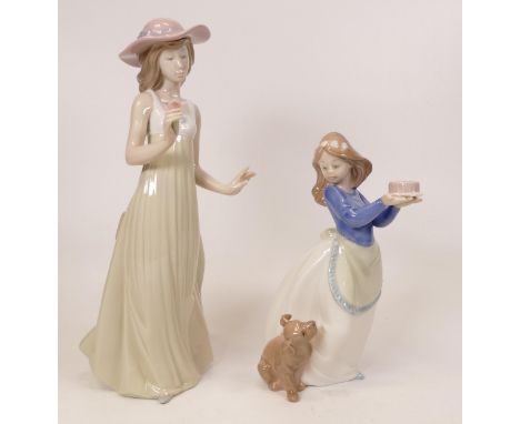 Two Nao figures girl with puppy and a lady holding a flower.  Height of tallest 26cm (2) 