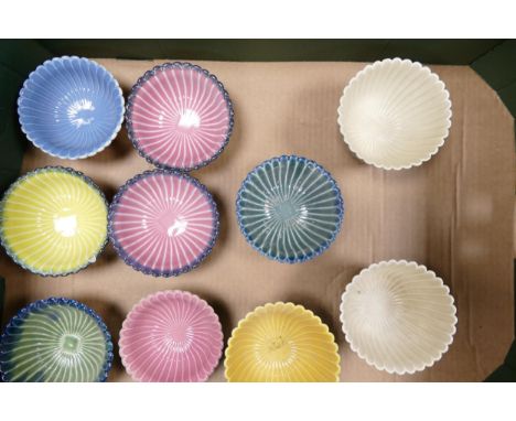 A collection of Wade Ceramic Ruffled Edged small bowls in varying colours.  These were removed from the archives of the Wade 