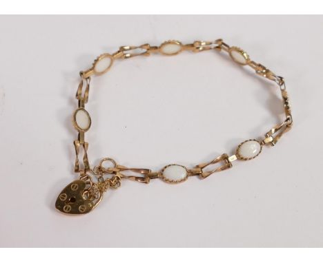 9ct gold ladies bracelet set with 7 oval opal stones, 4.1g. 