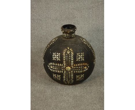 A large Indian iron water carrying bottle hand painted with a white enamel geometric design. H.42 Dia.35cm. 