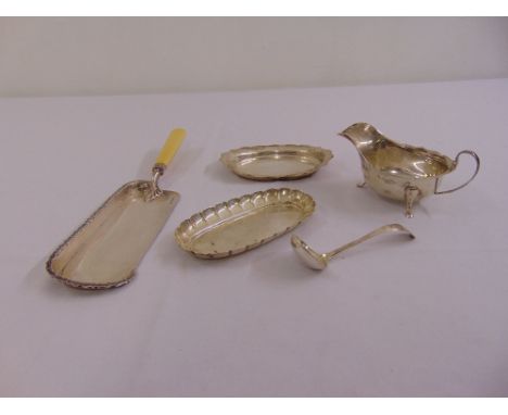 A quantity of silver to include a Victorian pen tray of oval form, a sauce boat on stand and ladle and a hallmarked crumb sco
