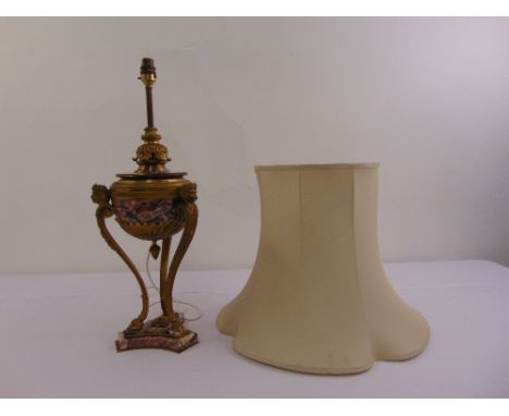 A gilt metal and marble table lamp the central bowl supported by three caryatids on triform base with silk shade