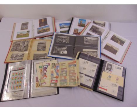 A quantity of vintage and 20th century postcards and stamps