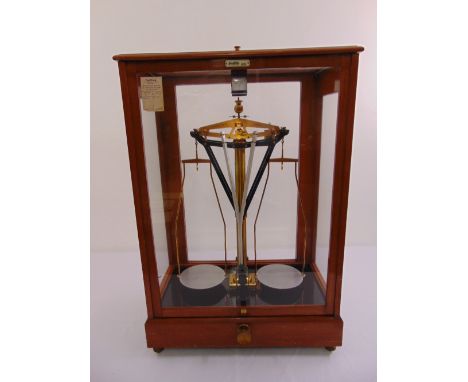 Oertling of London brass balance scale in glazed wooden cabinet