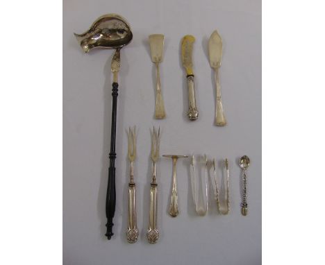 A quantity of white metal flatware to include a ladle with turned ebony handle and a pair of serving forks