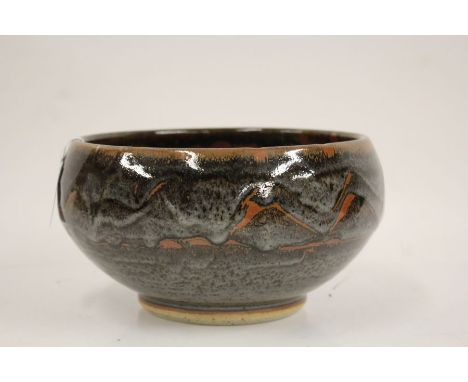 John Leach for Muchelney Pottery, a bowl, the bulbous body with wax resist decoration, stamped "16" to foot, 14cm diameter
