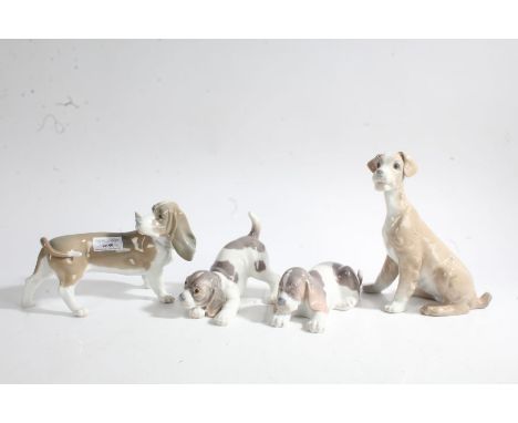 Four Lladro porcelain dogs, the tallest 19.5cm tall (4)
