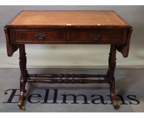 A Regency style mahogany two drawer sofa table on outswept supports, 94cm wide x 77cm high. 