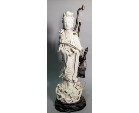 A 20th century blanc de chine figure of Guan Xin, converted to a table lamp, 47cm high.