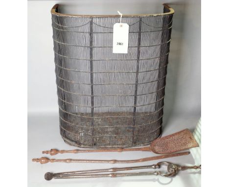 A 19th century nursery fender, 55cm wide and a group of three fire tools, (4).